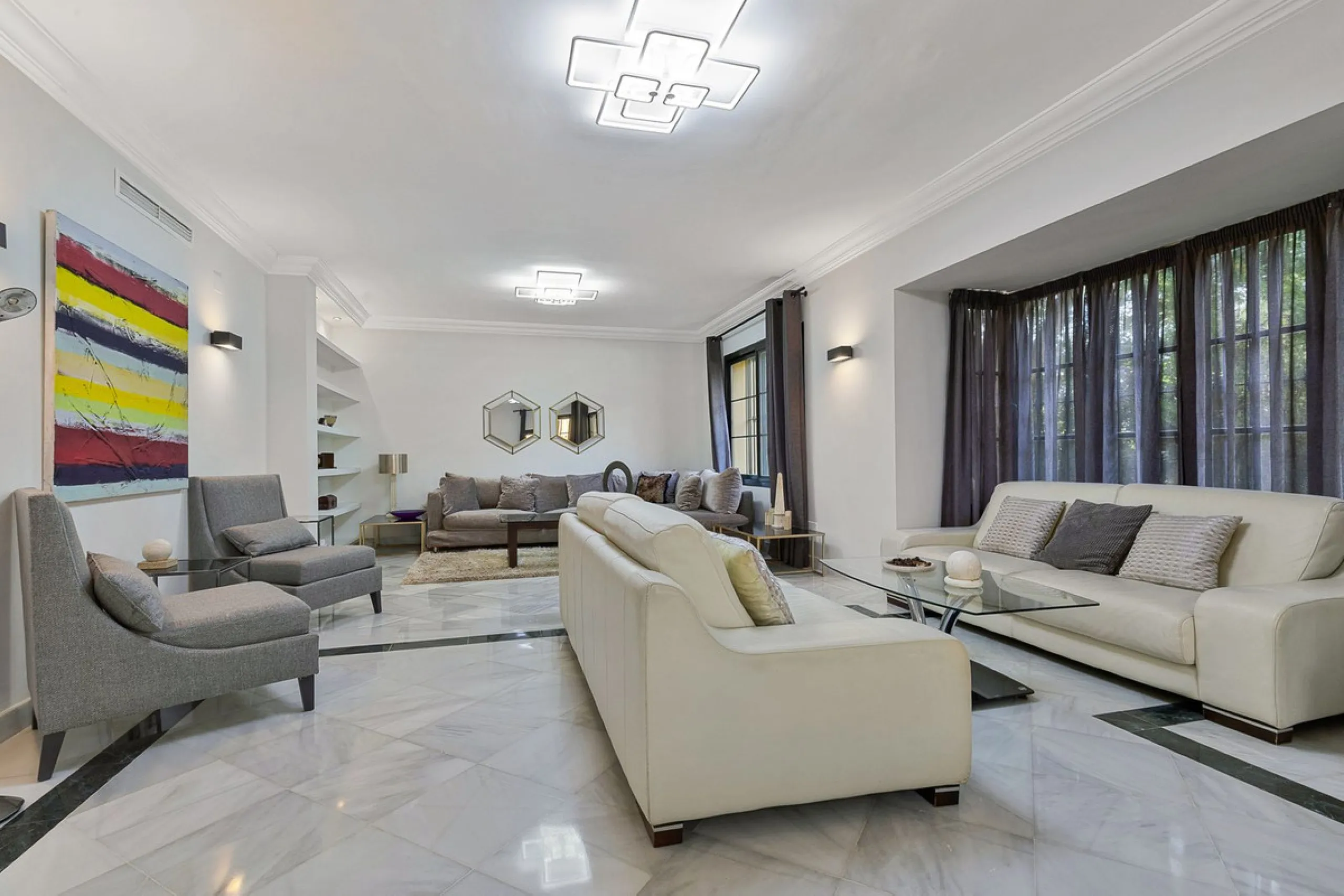 This classic Andalusian-style villa, set within the prestigious residential enclave of Casasola, Guadalmina Baja, represents a rare opportunity to acquire a substantial family home just moments from the sea, with exceptional scope for refurbishment and pe