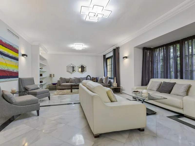 This classic Andalusian-style villa, set within the prestigious residential enclave of Casasola, Guadalmina Baja, represents a rare opportunity to acquire a substantial family home just moments from the sea, with exceptional scope for refurbishment and pe