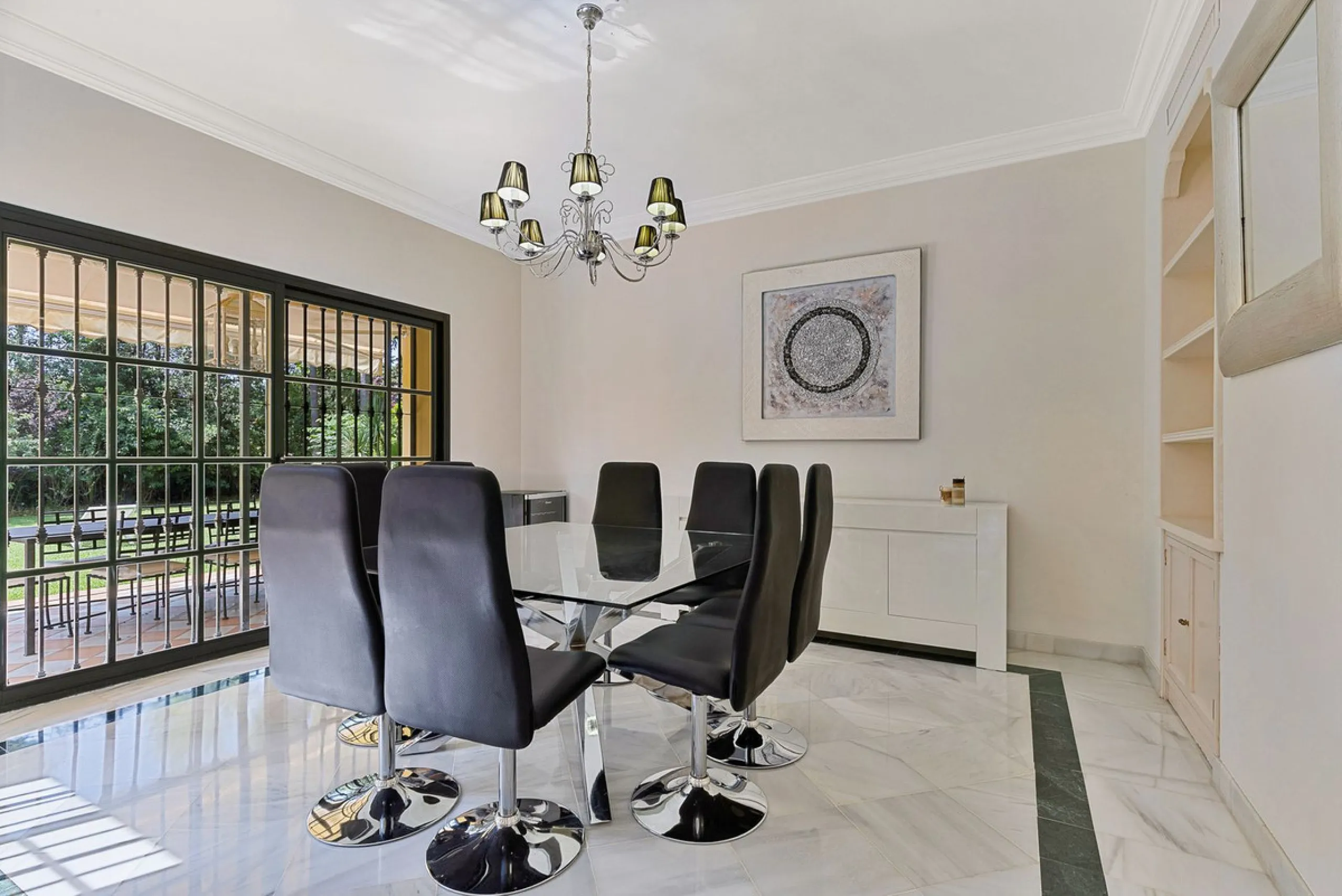 This classic Andalusian-style villa, set within the prestigious residential enclave of Casasola, Guadalmina Baja, represents a rare opportunity to acquire a substantial family home just moments from the sea, with exceptional scope for refurbishment and pe