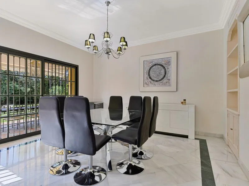 This classic Andalusian-style villa, set within the prestigious residential enclave of Casasola, Guadalmina Baja, represents a rare opportunity to acquire a substantial family home just moments from the sea, with exceptional scope for refurbishment and pe
