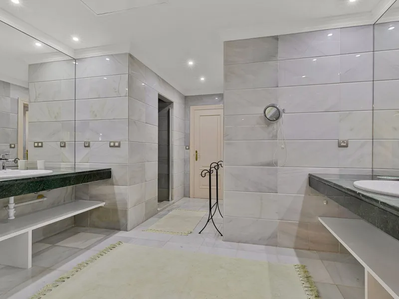 This classic Andalusian-style villa, set within the prestigious residential enclave of Casasola, Guadalmina Baja, represents a rare opportunity to acquire a substantial family home just moments from the sea, with exceptional scope for refurbishment and pe