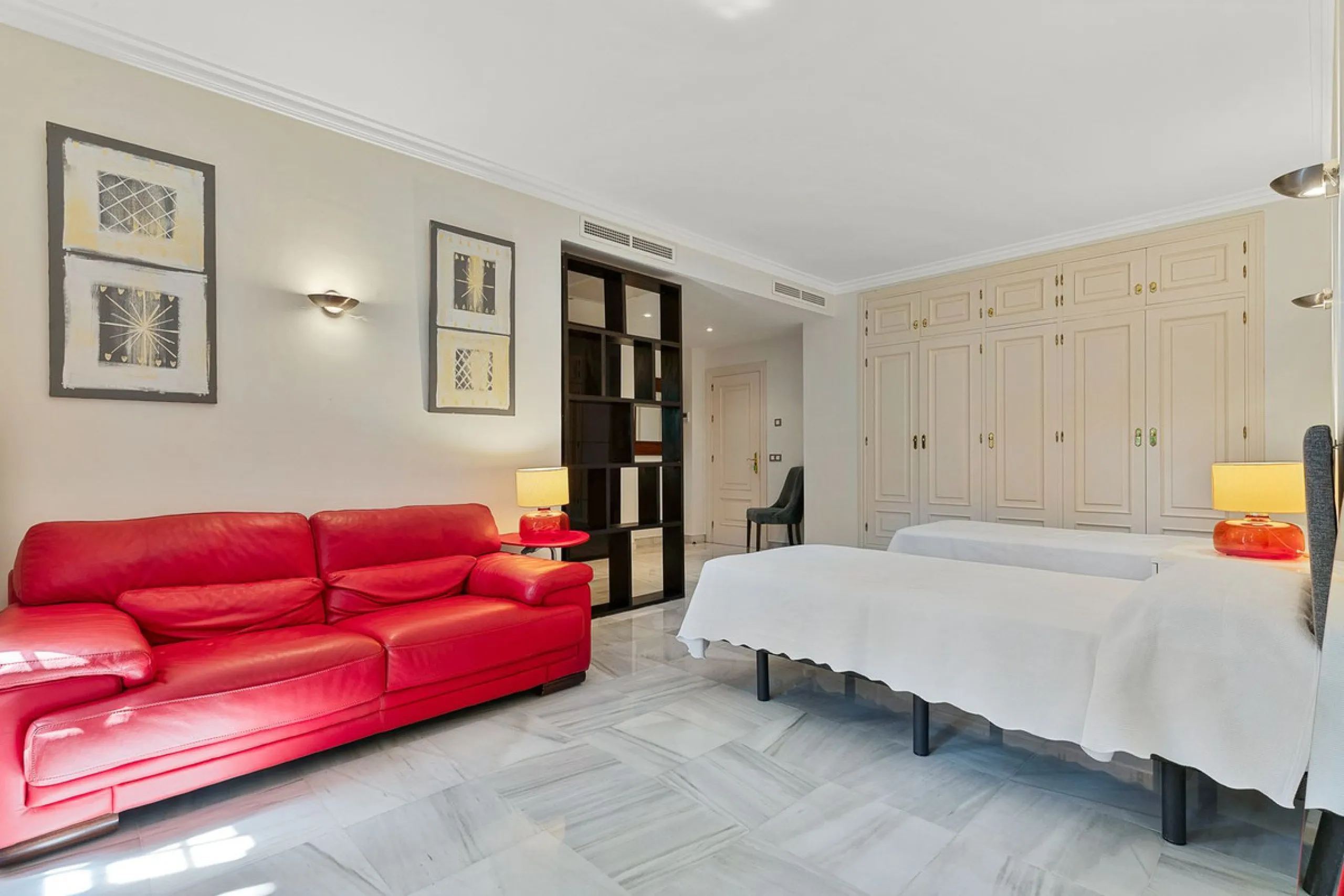 This classic Andalusian-style villa, set within the prestigious residential enclave of Casasola, Guadalmina Baja, represents a rare opportunity to acquire a substantial family home just moments from the sea, with exceptional scope for refurbishment and pe
