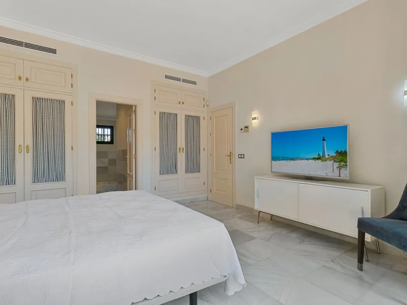 This classic Andalusian-style villa, set within the prestigious residential enclave of Casasola, Guadalmina Baja, represents a rare opportunity to acquire a substantial family home just moments from the sea, with exceptional scope for refurbishment and pe