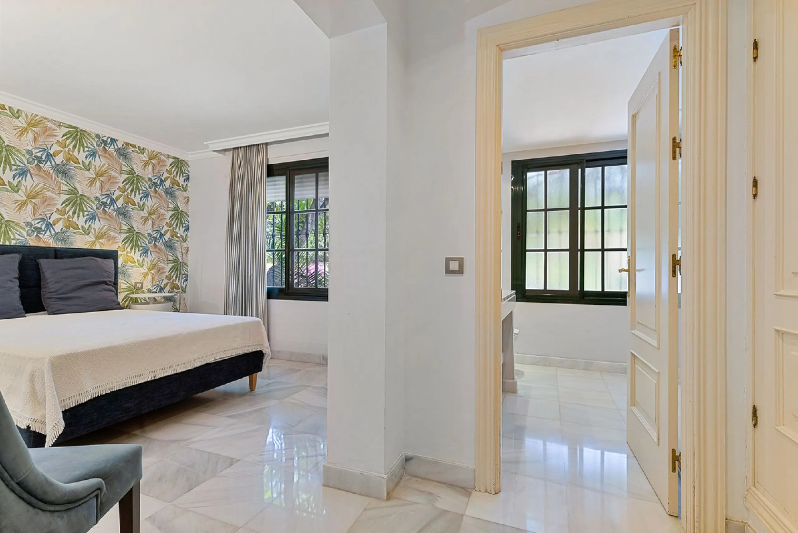 This classic Andalusian-style villa, set within the prestigious residential enclave of Casasola, Guadalmina Baja, represents a rare opportunity to acquire a substantial family home just moments from the sea, with exceptional scope for refurbishment and pe