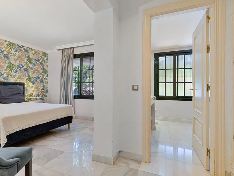 This classic Andalusian-style villa, set within the prestigious residential enclave of Casasola, Guadalmina Baja, represents a rare opportunity to acquire a substantial family home just moments from the sea, with exceptional scope for refurbishment and pe