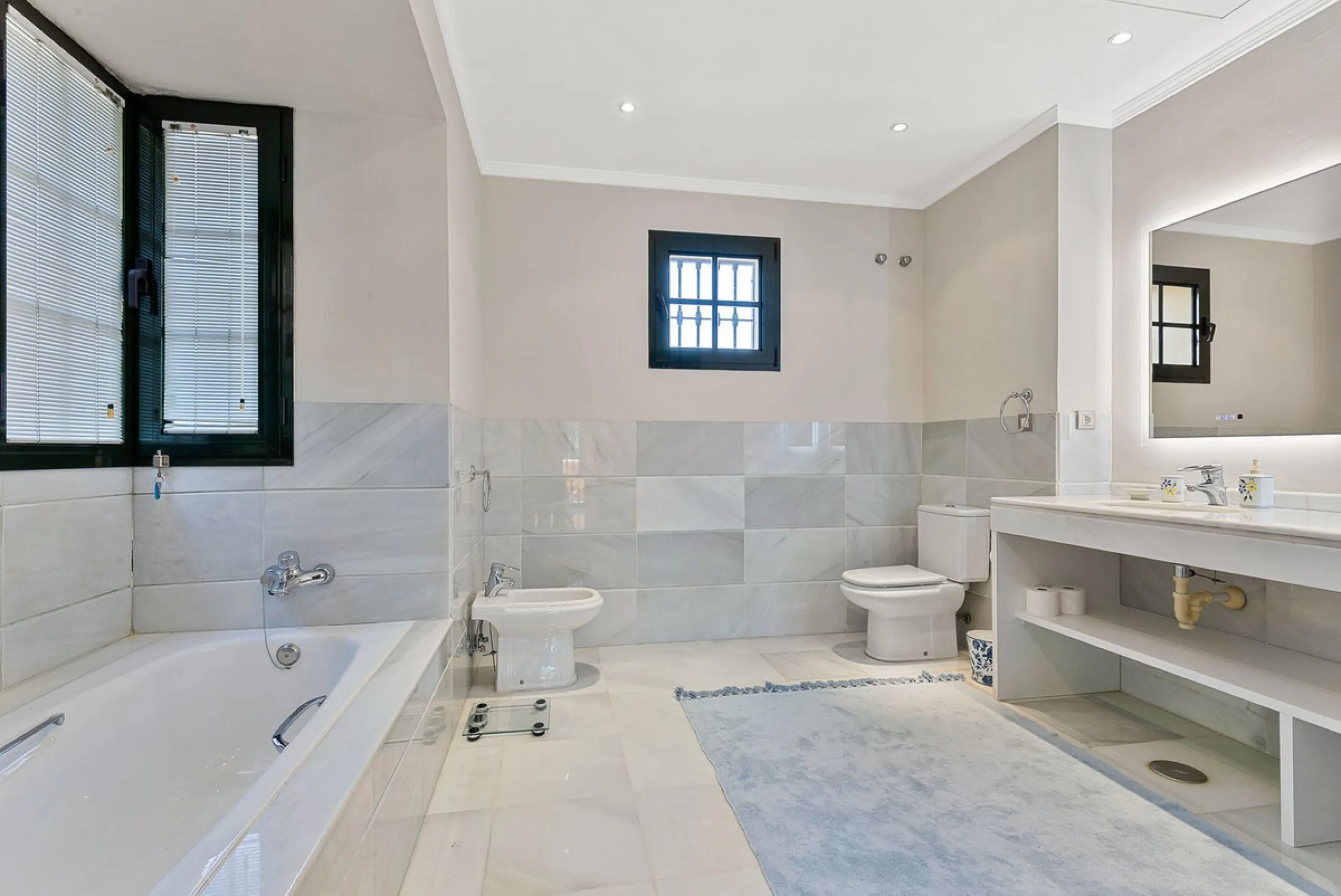 This classic Andalusian-style villa, set within the prestigious residential enclave of Casasola, Guadalmina Baja, represents a rare opportunity to acquire a substantial family home just moments from the sea, with exceptional scope for refurbishment and pe