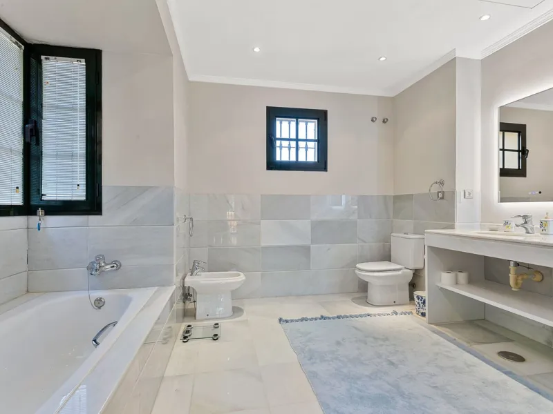 This classic Andalusian-style villa, set within the prestigious residential enclave of Casasola, Guadalmina Baja, represents a rare opportunity to acquire a substantial family home just moments from the sea, with exceptional scope for refurbishment and pe