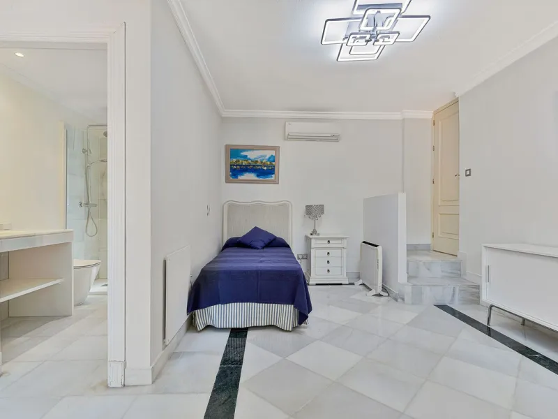 This classic Andalusian-style villa, set within the prestigious residential enclave of Casasola, Guadalmina Baja, represents a rare opportunity to acquire a substantial family home just moments from the sea, with exceptional scope for refurbishment and pe