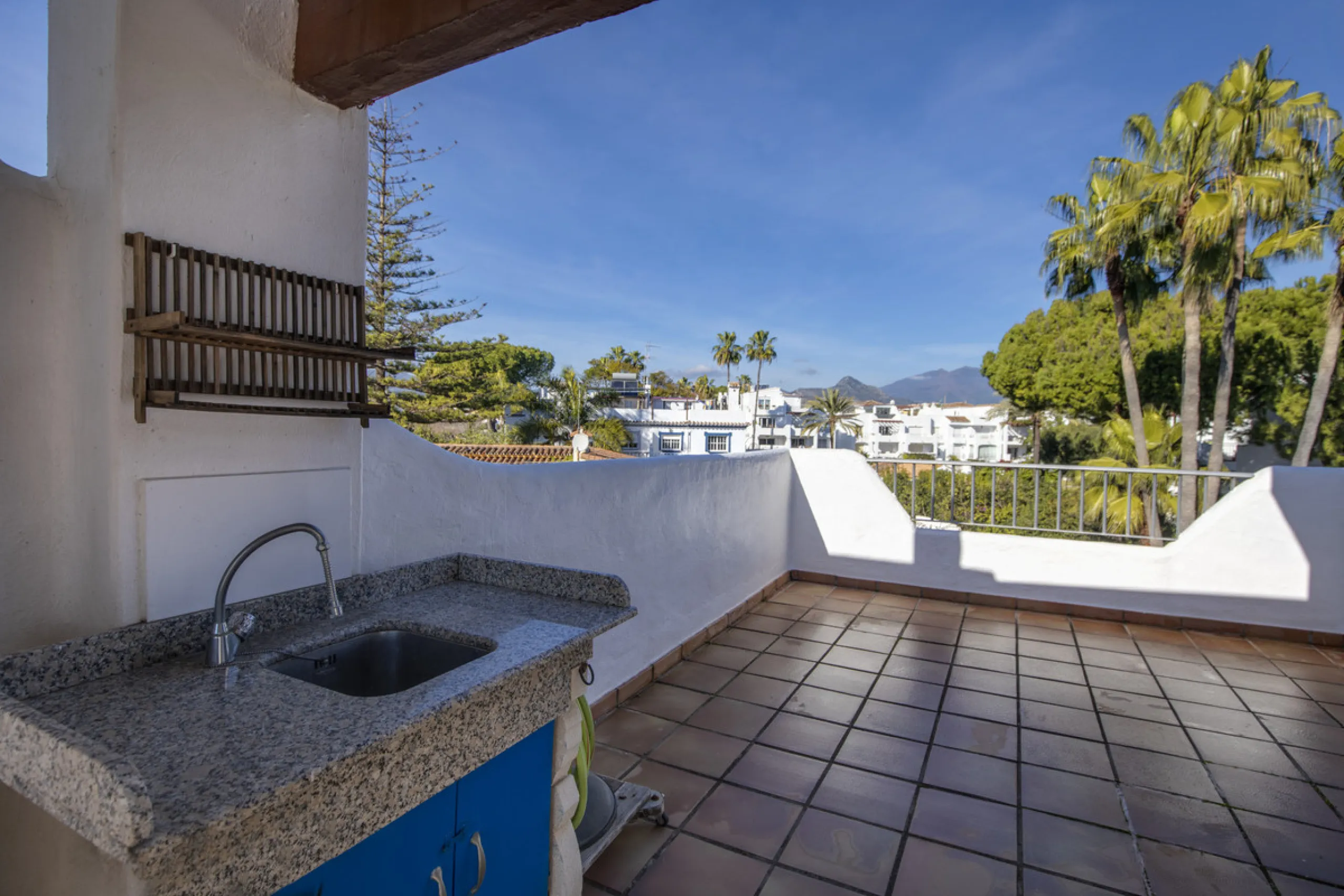 This charming two-level property offers spacious and versatile accommodation, finished to a high standard and filled with natural light throughout. The large living room is a welcoming focal point, featuring marble flooring, a beamed ceiling, a wood-burni