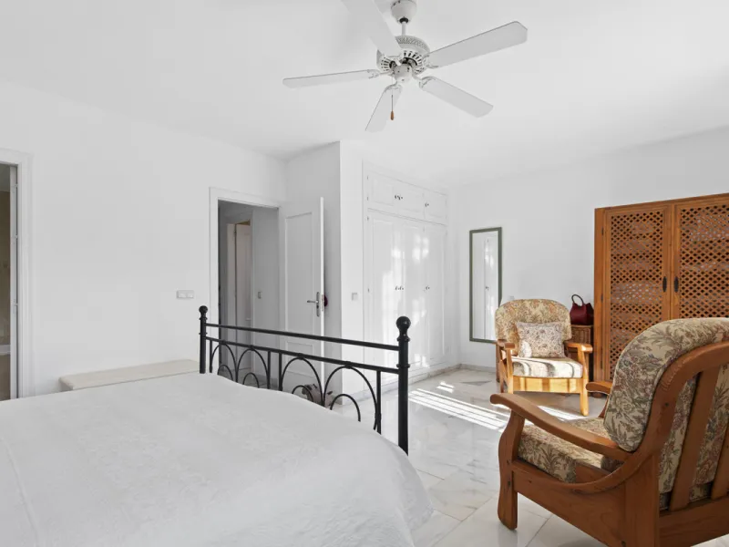 This charming two-level property offers spacious and versatile accommodation, finished to a high standard and filled with natural light throughout. The large living room is a welcoming focal point, featuring marble flooring, a beamed ceiling, a wood-burni
