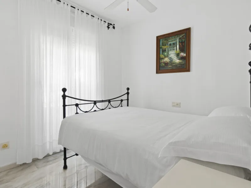 This charming two-level property offers spacious and versatile accommodation, finished to a high standard and filled with natural light throughout. The large living room is a welcoming focal point, featuring marble flooring, a beamed ceiling, a wood-burni