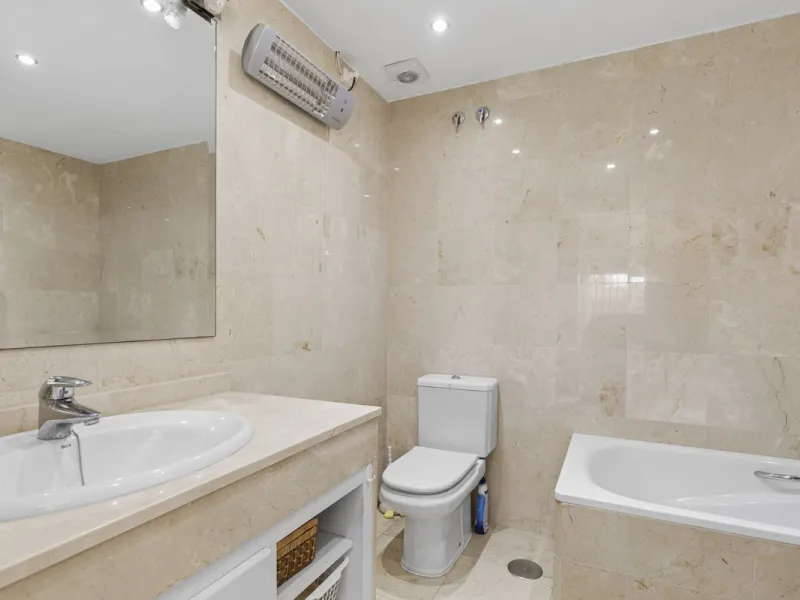 This charming two-level property offers spacious and versatile accommodation, finished to a high standard and filled with natural light throughout. The large living room is a welcoming focal point, featuring marble flooring, a beamed ceiling, a wood-burni