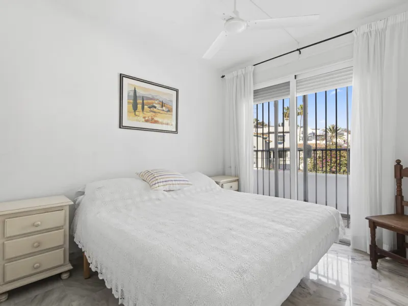 This charming two-level property offers spacious and versatile accommodation, finished to a high standard and filled with natural light throughout. The large living room is a welcoming focal point, featuring marble flooring, a beamed ceiling, a wood-burni