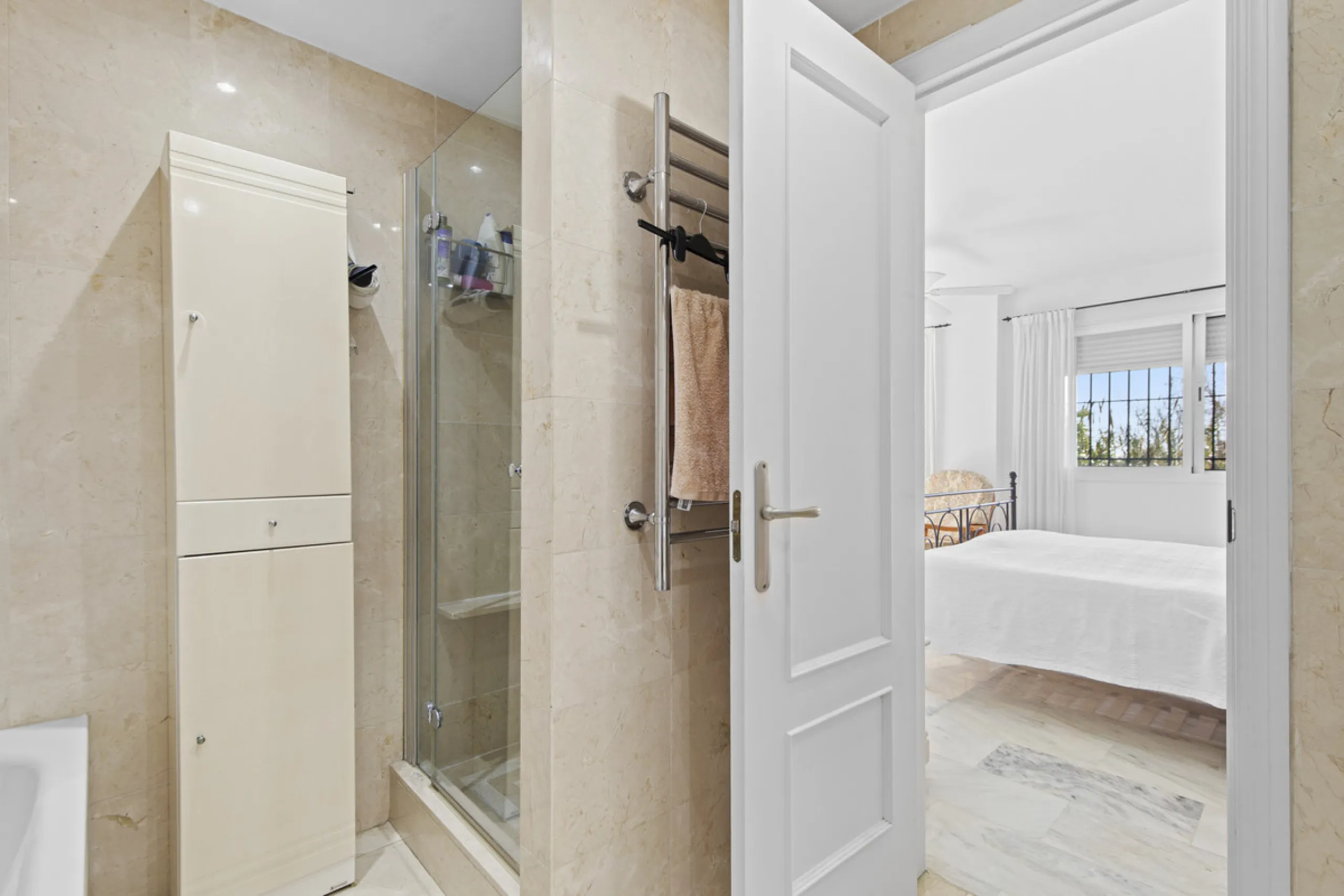This charming two-level property offers spacious and versatile accommodation, finished to a high standard and filled with natural light throughout. The large living room is a welcoming focal point, featuring marble flooring, a beamed ceiling, a wood-burni