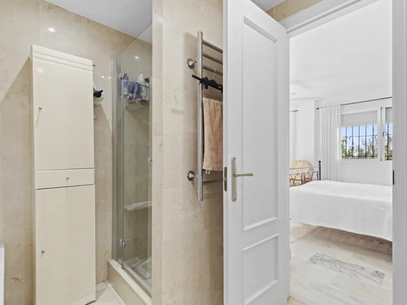 This charming two-level property offers spacious and versatile accommodation, finished to a high standard and filled with natural light throughout. The large living room is a welcoming focal point, featuring marble flooring, a beamed ceiling, a wood-burni
