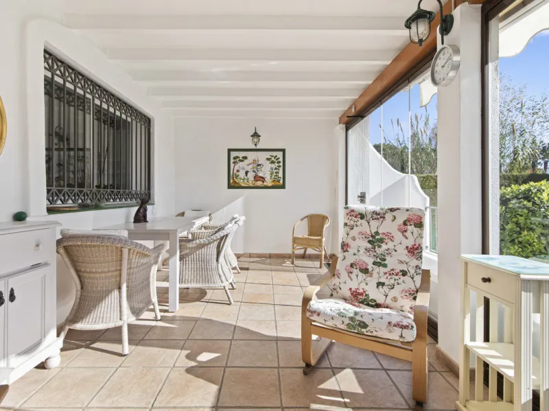 This charming two-level property offers spacious and versatile accommodation, finished to a high standard and filled with natural light throughout. The large living room is a welcoming focal point, featuring marble flooring, a beamed ceiling, a wood-burni