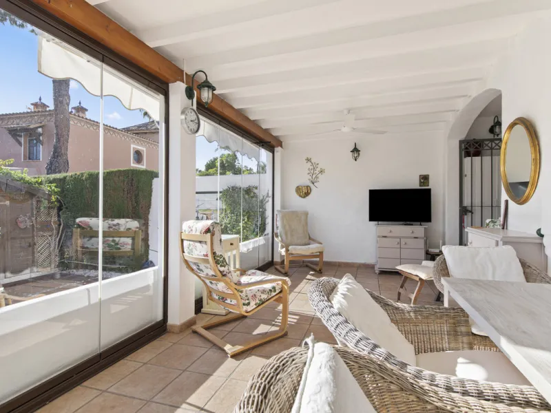 This charming two-level property offers spacious and versatile accommodation, finished to a high standard and filled with natural light throughout. The large living room is a welcoming focal point, featuring marble flooring, a beamed ceiling, a wood-burni