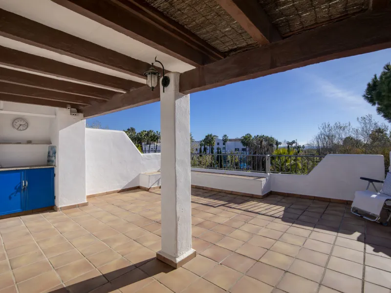This charming two-level property offers spacious and versatile accommodation, finished to a high standard and filled with natural light throughout. The large living room is a welcoming focal point, featuring marble flooring, a beamed ceiling, a wood-burni