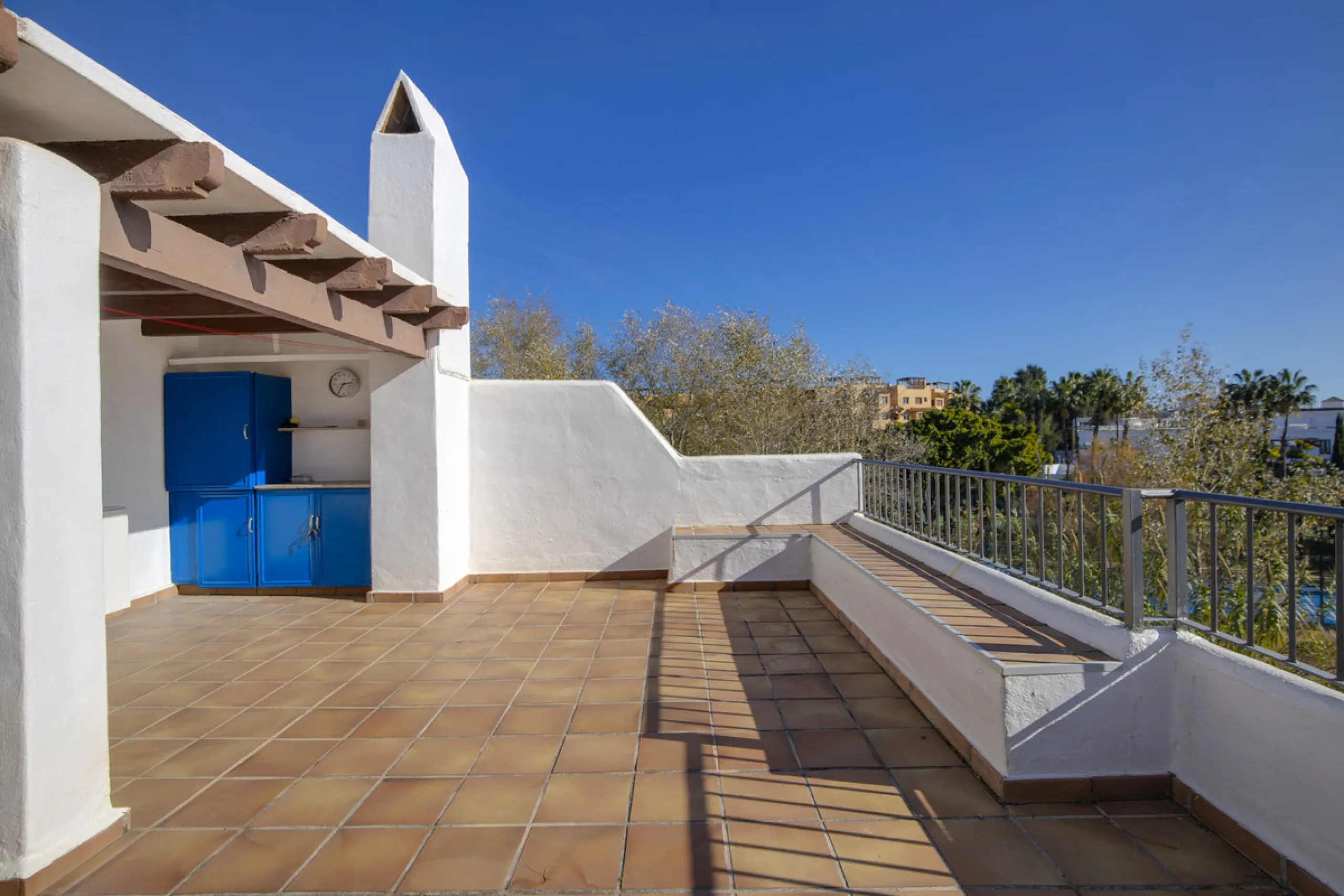 This charming two-level property offers spacious and versatile accommodation, finished to a high standard and filled with natural light throughout. The large living room is a welcoming focal point, featuring marble flooring, a beamed ceiling, a wood-burni