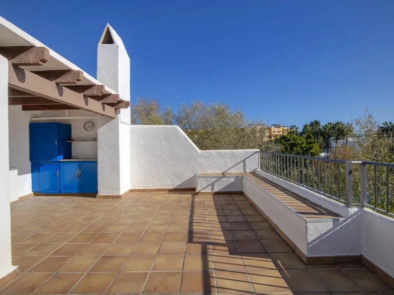 This charming two-level property offers spacious and versatile accommodation, finished to a high standard and filled with natural light throughout. The large living room is a welcoming focal point, featuring marble flooring, a beamed ceiling, a wood-burni
