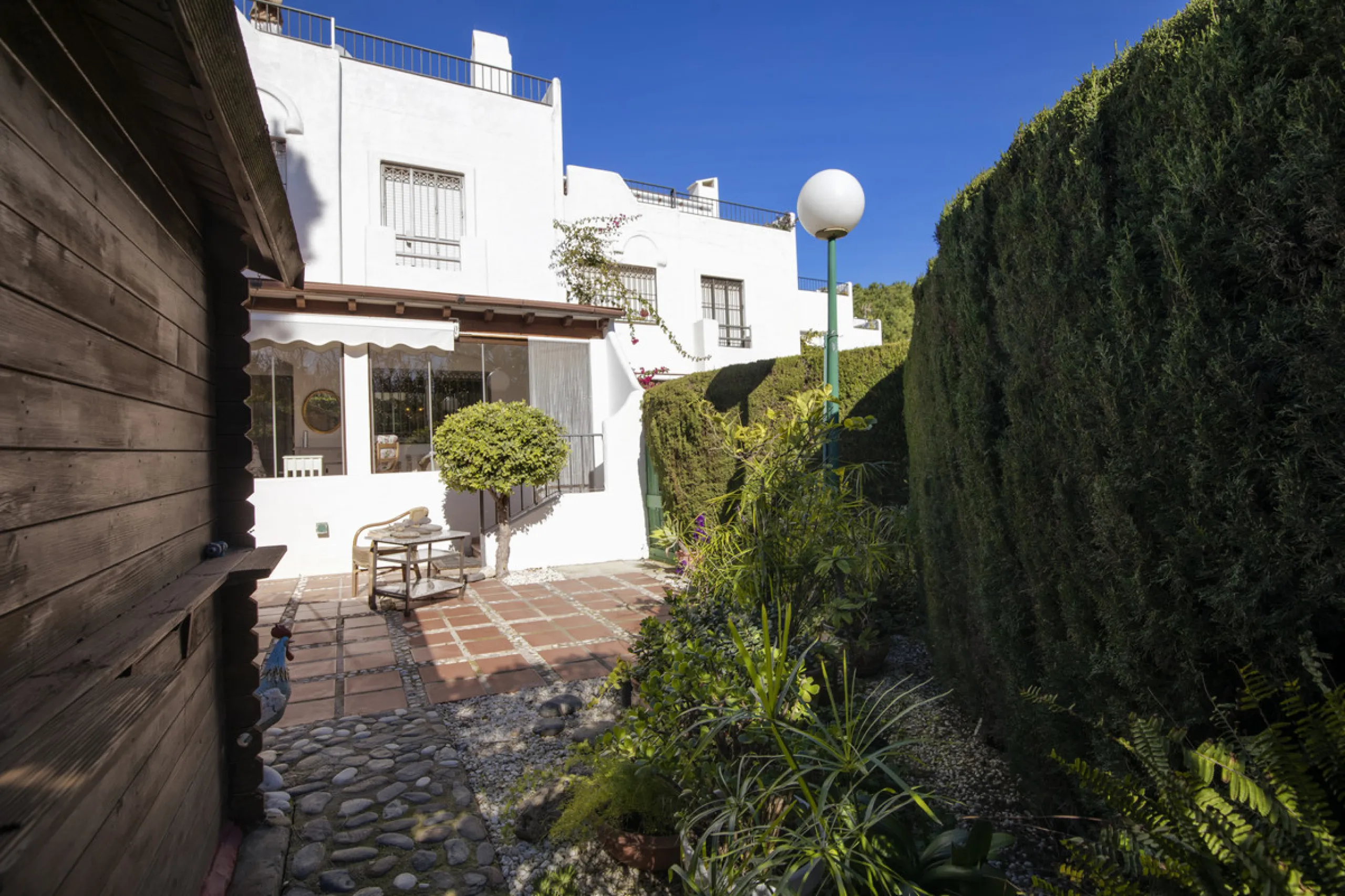 This charming two-level property offers spacious and versatile accommodation, finished to a high standard and filled with natural light throughout. The large living room is a welcoming focal point, featuring marble flooring, a beamed ceiling, a wood-burni