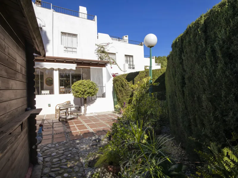 This charming two-level property offers spacious and versatile accommodation, finished to a high standard and filled with natural light throughout. The large living room is a welcoming focal point, featuring marble flooring, a beamed ceiling, a wood-burni