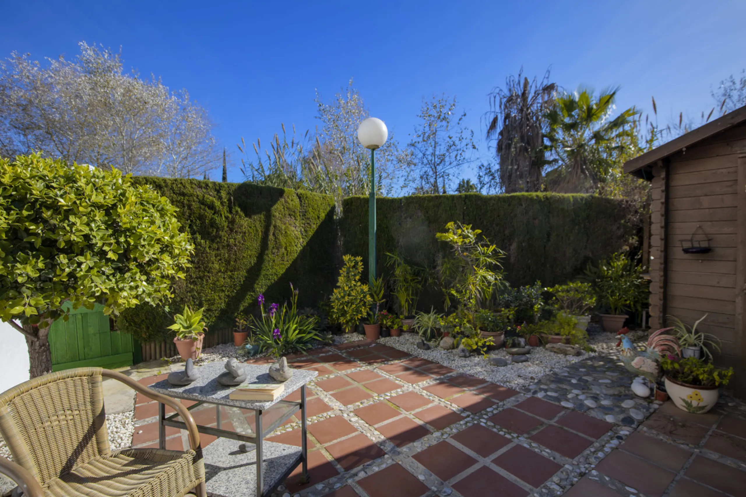 This charming two-level property offers spacious and versatile accommodation, finished to a high standard and filled with natural light throughout. The large living room is a welcoming focal point, featuring marble flooring, a beamed ceiling, a wood-burni