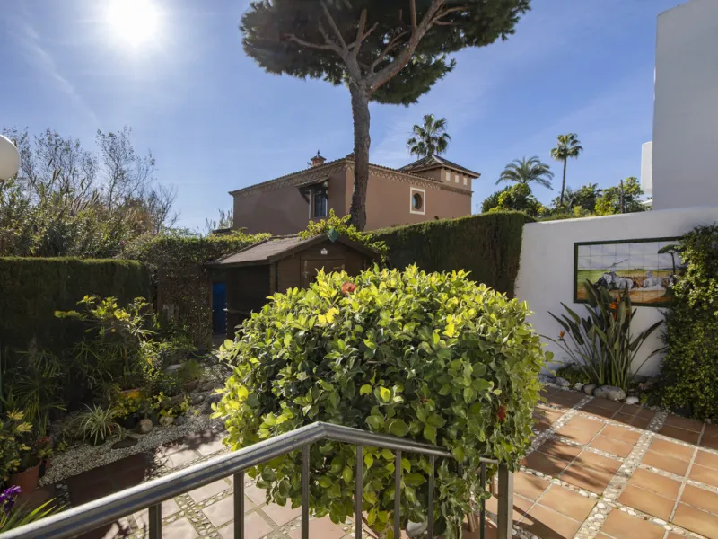 This charming two-level property offers spacious and versatile accommodation, finished to a high standard and filled with natural light throughout. The large living room is a welcoming focal point, featuring marble flooring, a beamed ceiling, a wood-burni