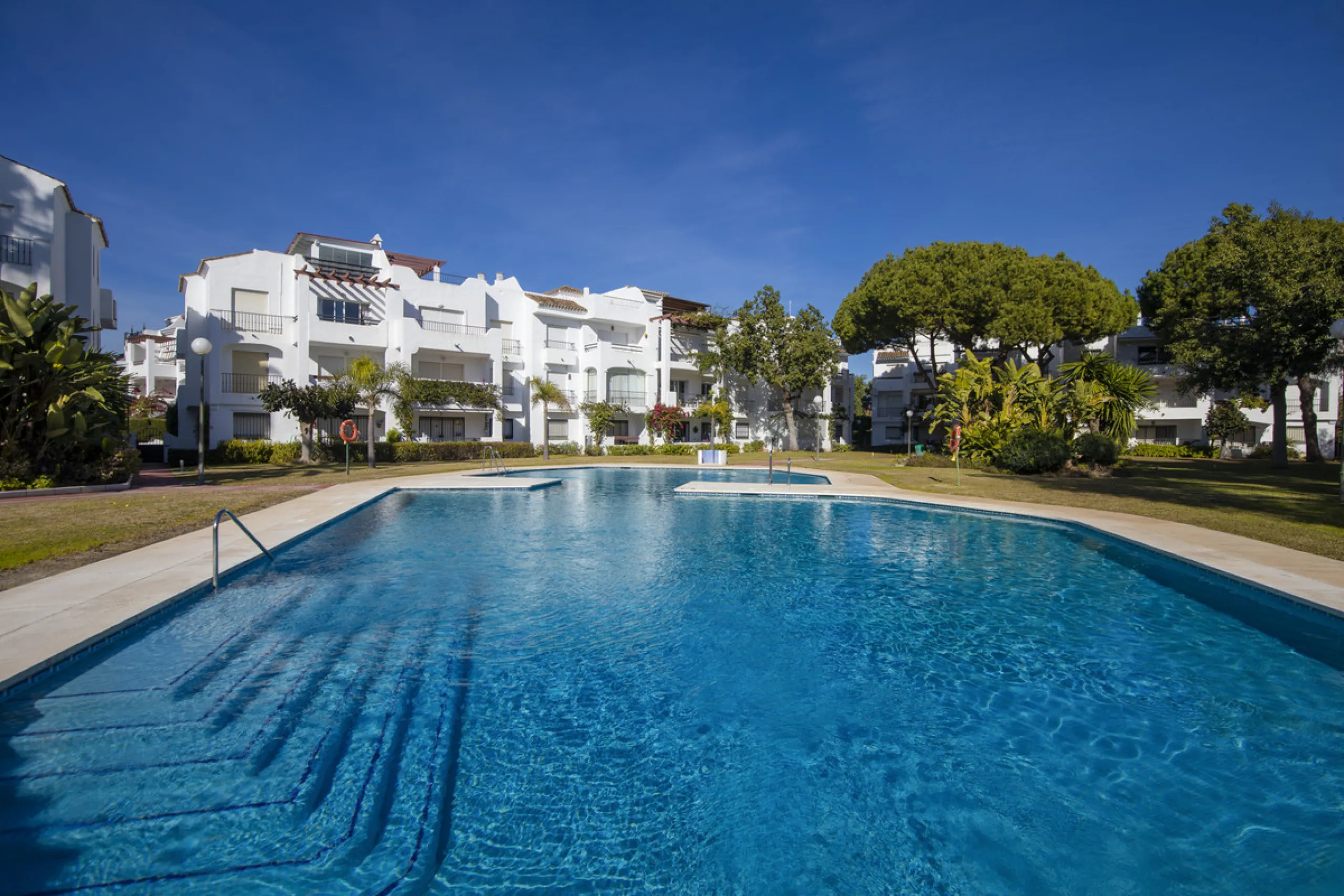 This charming two-level property offers spacious and versatile accommodation, finished to a high standard and filled with natural light throughout. The large living room is a welcoming focal point, featuring marble flooring, a beamed ceiling, a wood-burni
