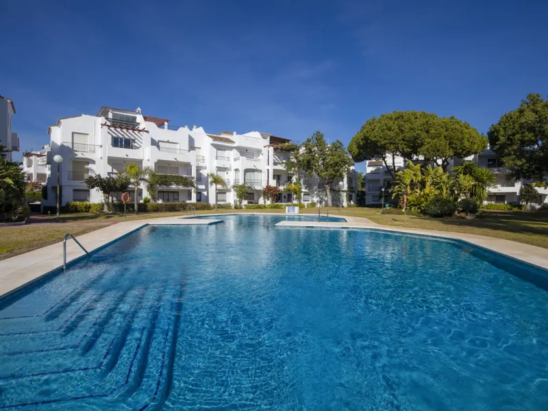 This charming two-level property offers spacious and versatile accommodation, finished to a high standard and filled with natural light throughout. The large living room is a welcoming focal point, featuring marble flooring, a beamed ceiling, a wood-burni