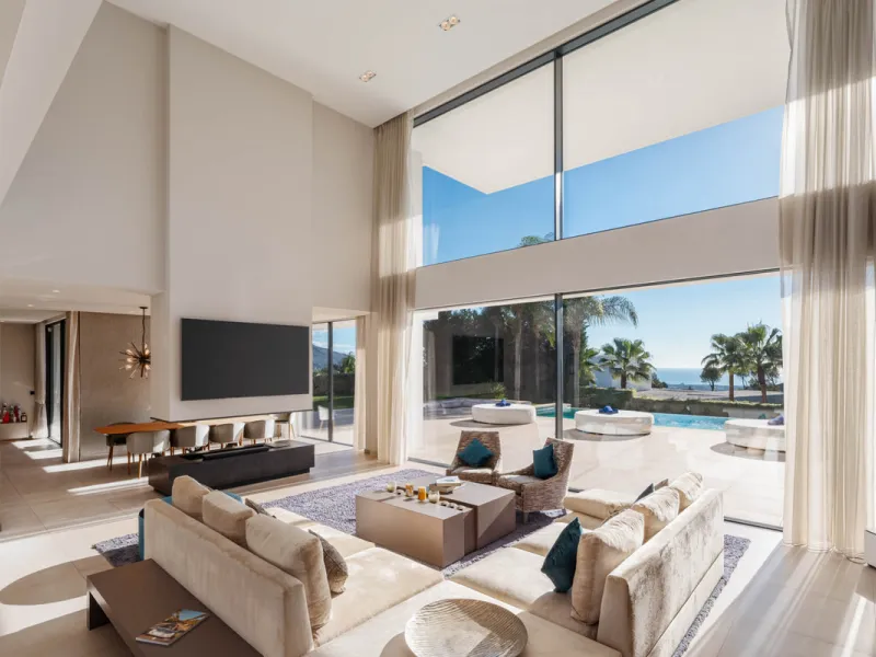 Designed by a distinguished architect, this villa is spread over two levels with an impressive built area. It features five luxurious bedrooms, each with its ensuite bathroom, an additional guest toilet, and a guest apartment that matches the main villa's