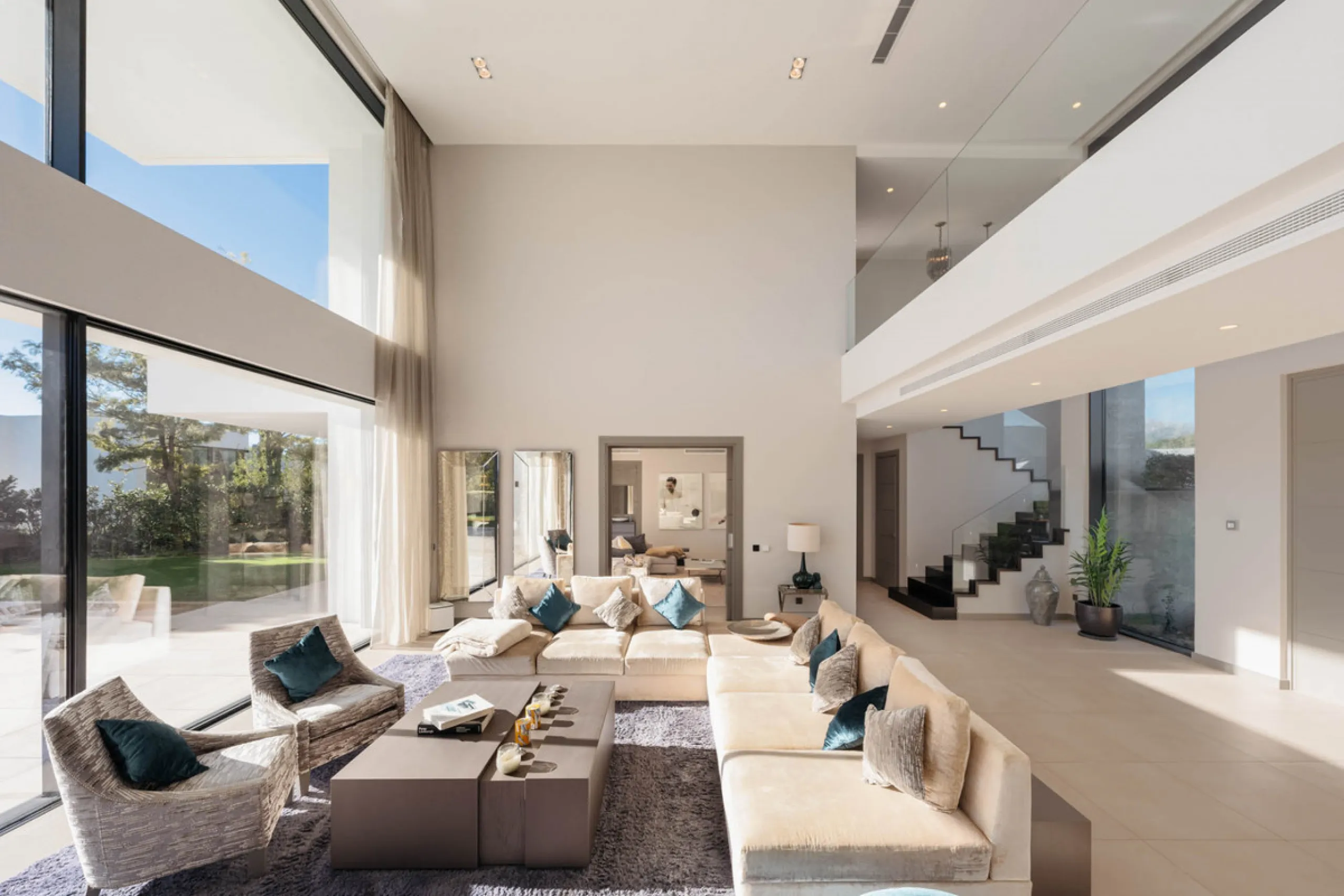 Designed by a distinguished architect, this villa is spread over two levels with an impressive built area. It features five luxurious bedrooms, each with its ensuite bathroom, an additional guest toilet, and a guest apartment that matches the main villa's
