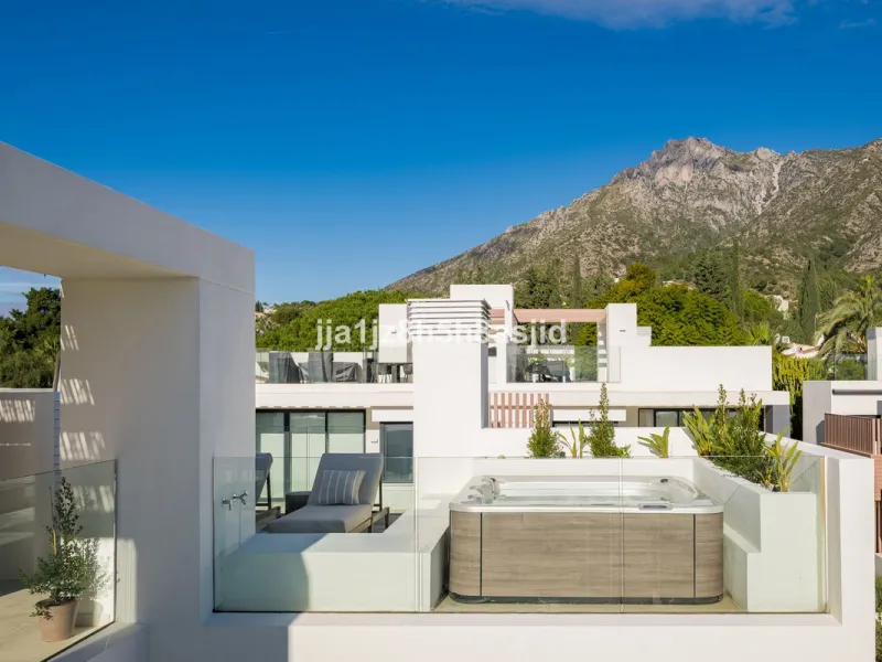 Set within the prestigious Le Blanc development in Sierra Blanca, one of Marbella's most sought-after residential enclaves, this exceptional semi-detached villa offers refined luxury living just six minutes from the beach and within walking distance of se