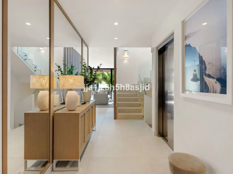 Set within the prestigious Le Blanc development in Sierra Blanca, one of Marbella's most sought-after residential enclaves, this exceptional semi-detached villa offers refined luxury living just six minutes from the beach and within walking distance of se