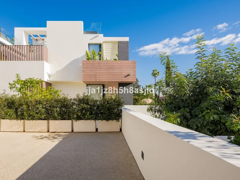 Set within the prestigious Le Blanc development in Sierra Blanca, one of Marbella's most sought-after residential enclaves, this exceptional semi-detached villa offers refined luxury living just six minutes from the beach and within walking distance of se
