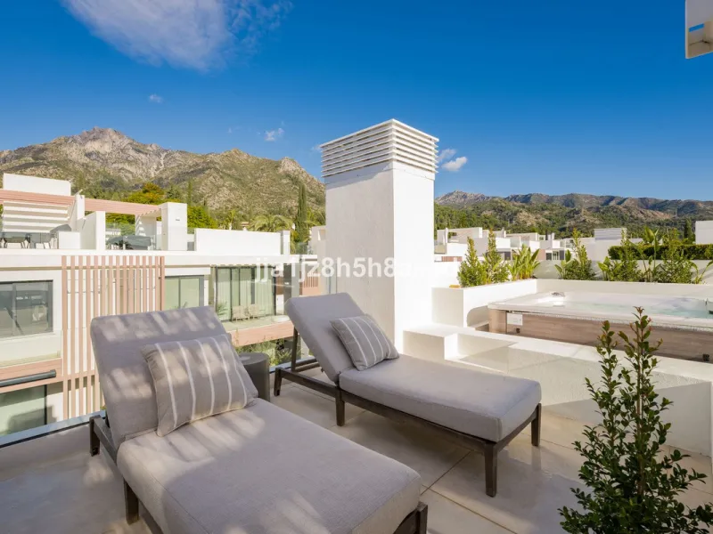 Set within the prestigious Le Blanc development in Sierra Blanca, one of Marbella's most sought-after residential enclaves, this exceptional semi-detached villa offers refined luxury living just six minutes from the beach and within walking distance of se