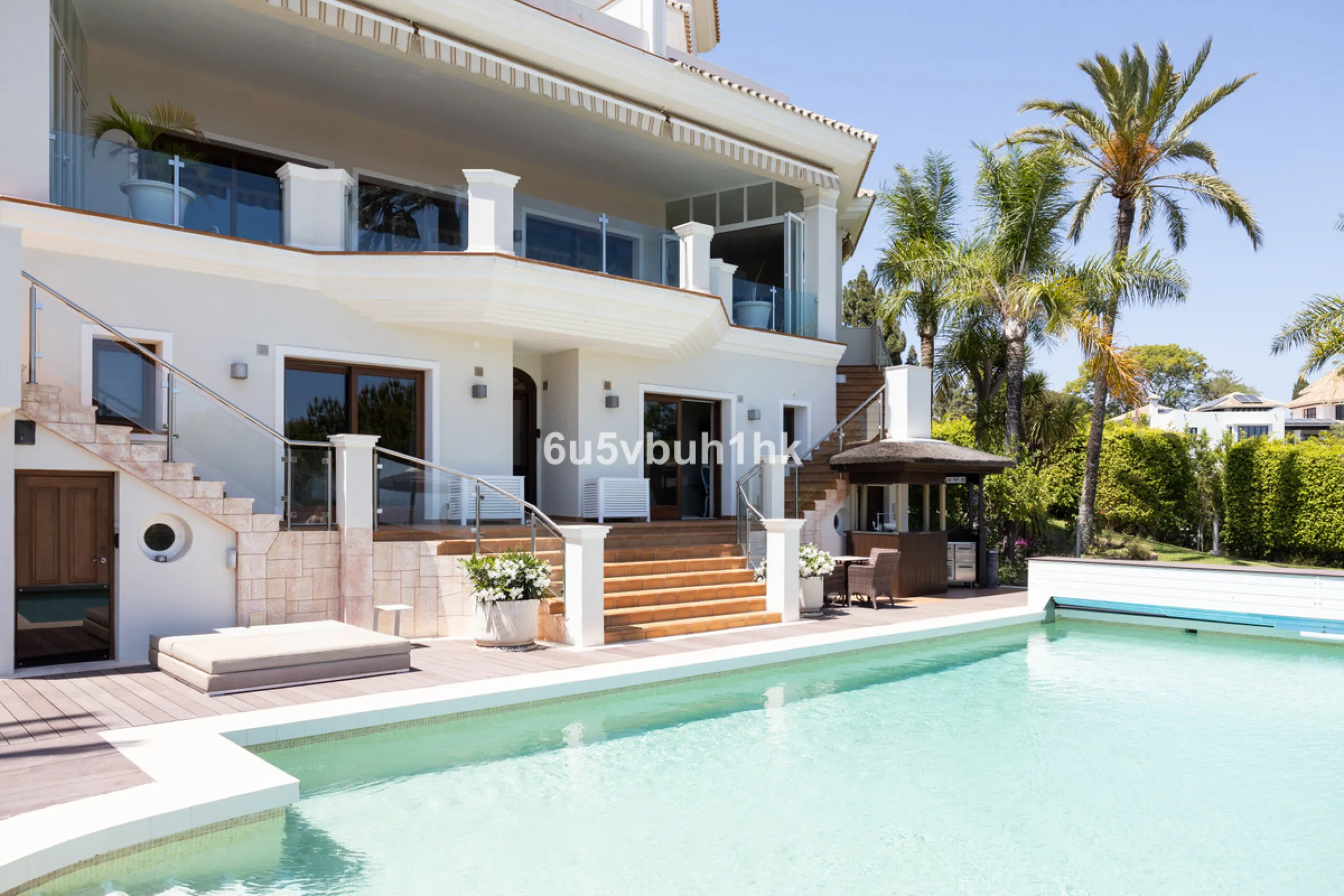 Nestled on a spacious 3,920 square meter plot, this generational Estate boasts a total built area of 842 square meters, spread across four floors with an elevator, located in one of Marbella's prime urbanizations. Surrounded by the lush nature of Las Chap