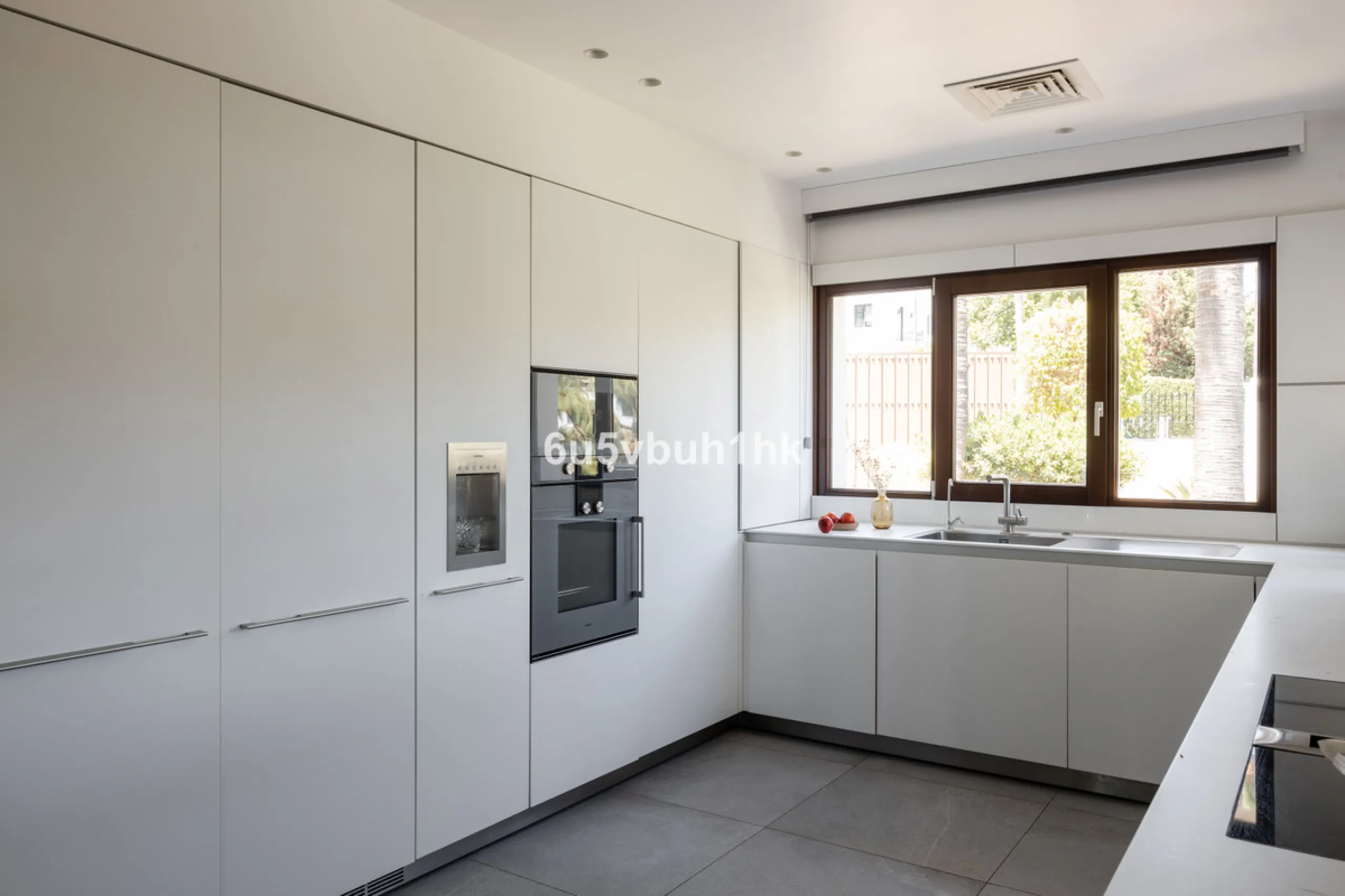 Nestled on a spacious 3,920 square meter plot, this generational Estate boasts a total built area of 842 square meters, spread across four floors with an elevator, located in one of Marbella's prime urbanizations. Surrounded by the lush nature of Las Chap
