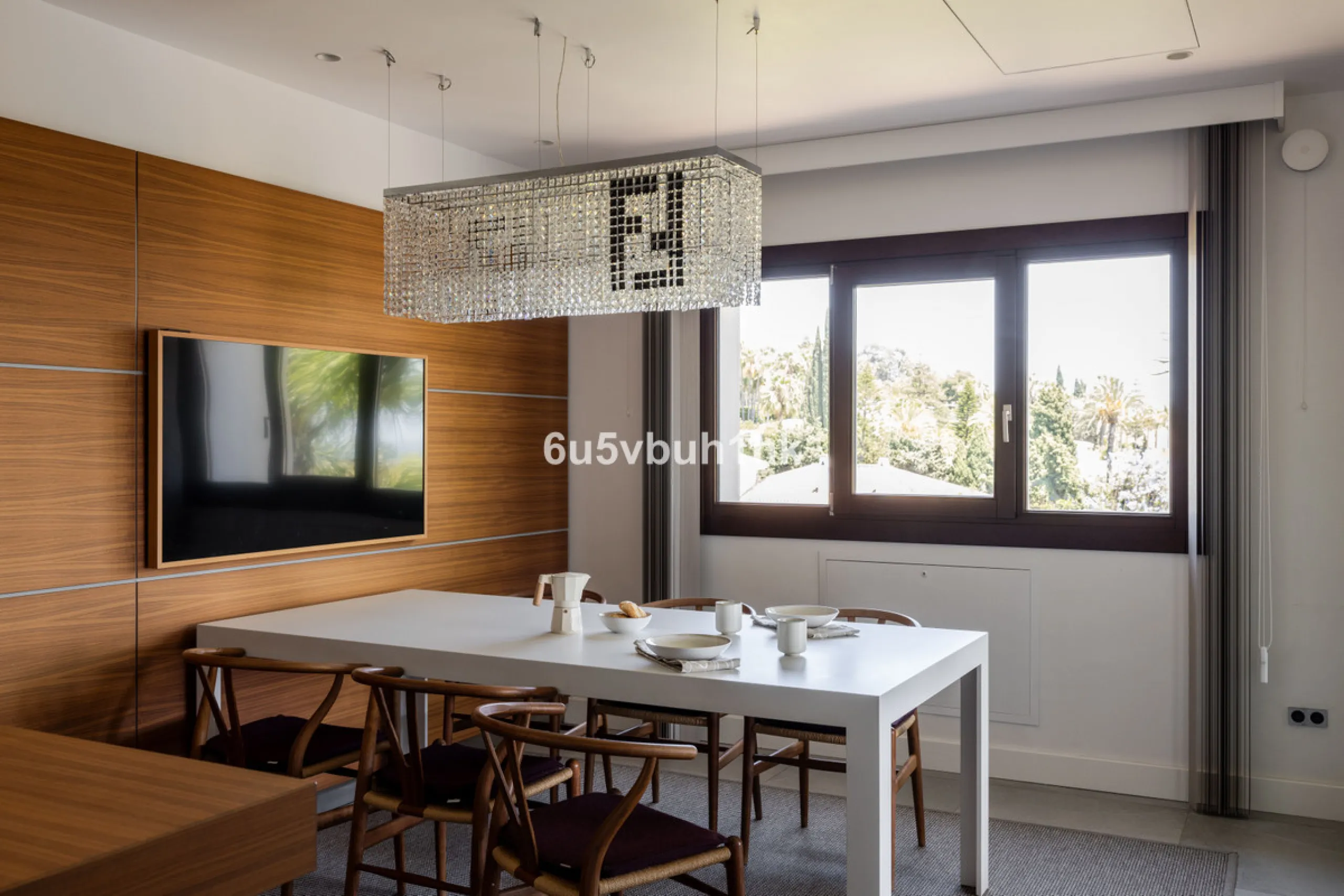 Nestled on a spacious 3,920 square meter plot, this generational Estate boasts a total built area of 842 square meters, spread across four floors with an elevator, located in one of Marbella's prime urbanizations. Surrounded by the lush nature of Las Chap