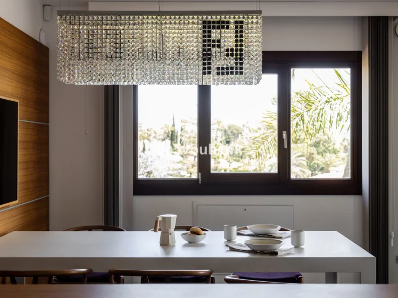 Nestled on a spacious 3,920 square meter plot, this generational Estate boasts a total built area of 842 square meters, spread across four floors with an elevator, located in one of Marbella's prime urbanizations. Surrounded by the lush nature of Las Chap