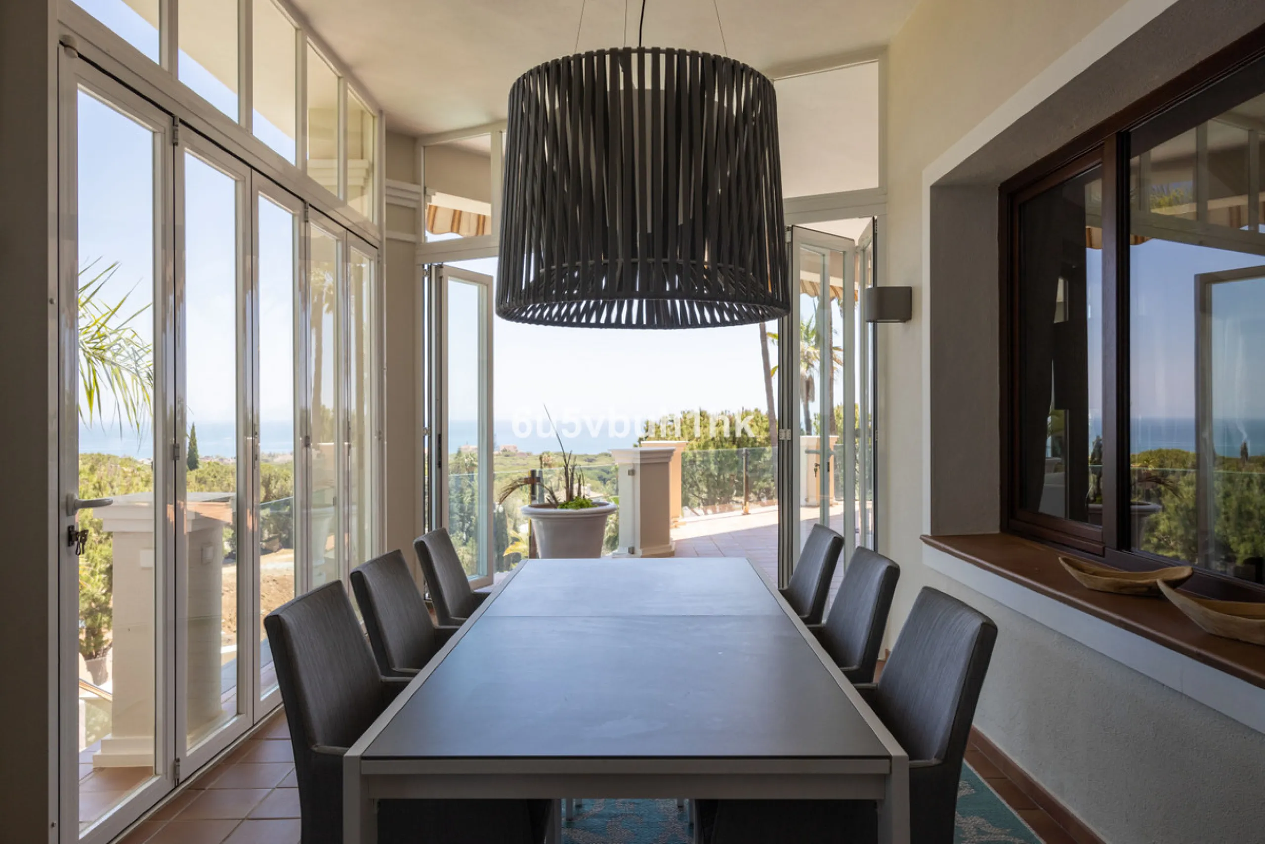 Nestled on a spacious 3,920 square meter plot, this generational Estate boasts a total built area of 842 square meters, spread across four floors with an elevator, located in one of Marbella's prime urbanizations. Surrounded by the lush nature of Las Chap
