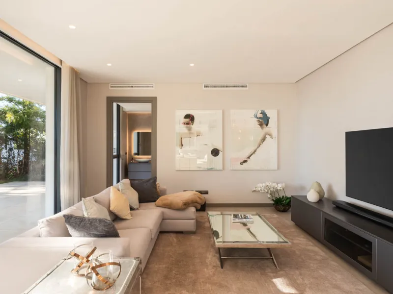 Designed by a distinguished architect, this villa is spread over two levels with an impressive built area. It features five luxurious bedrooms, each with its ensuite bathroom, an additional guest toilet, and a guest apartment that matches the main villa's