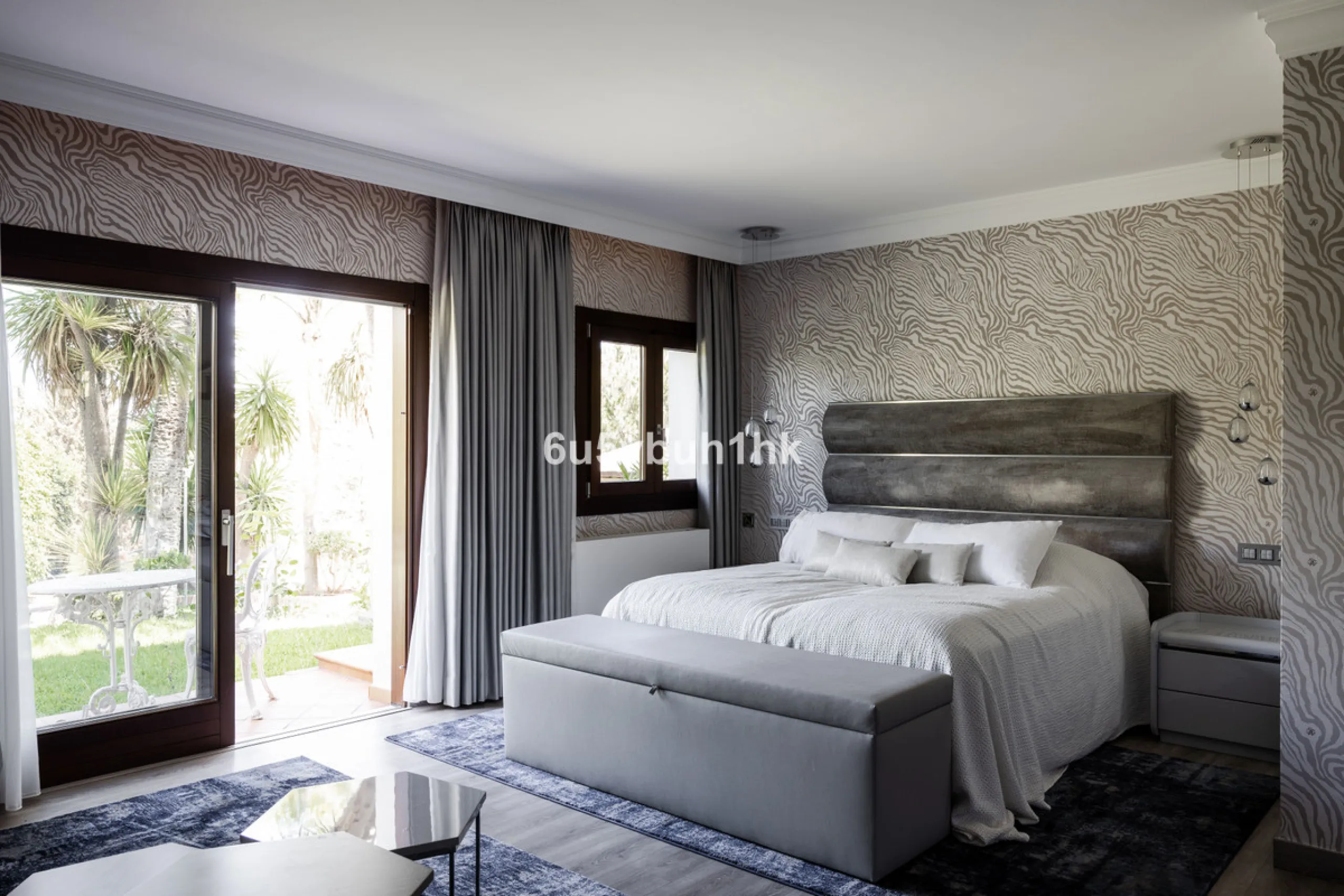 Nestled on a spacious 3,920 square meter plot, this generational Estate boasts a total built area of 842 square meters, spread across four floors with an elevator, located in one of Marbella's prime urbanizations. Surrounded by the lush nature of Las Chap