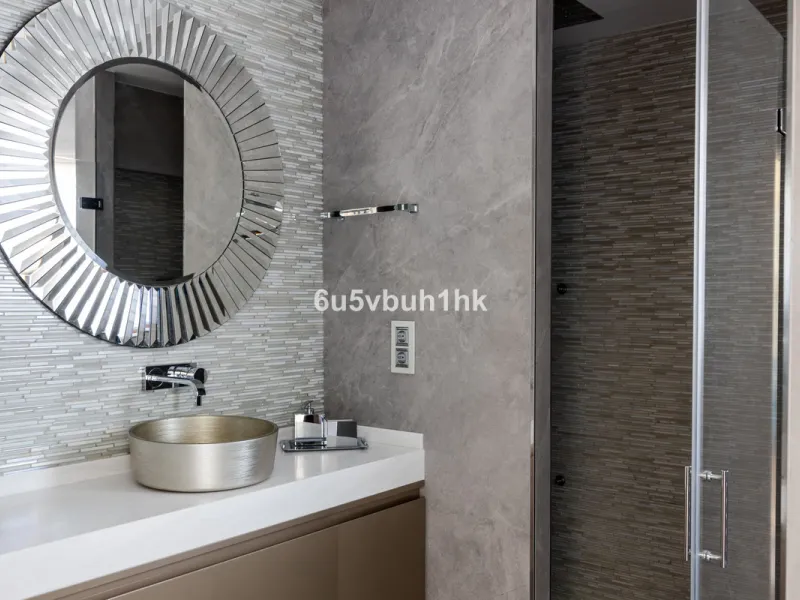 Nestled on a spacious 3,920 square meter plot, this generational Estate boasts a total built area of 842 square meters, spread across four floors with an elevator, located in one of Marbella's prime urbanizations. Surrounded by the lush nature of Las Chap