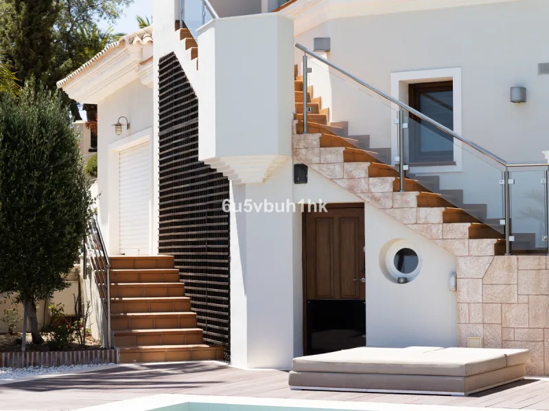 Nestled on a spacious 3,920 square meter plot, this generational Estate boasts a total built area of 842 square meters, spread across four floors with an elevator, located in one of Marbella's prime urbanizations. Surrounded by the lush nature of Las Chap