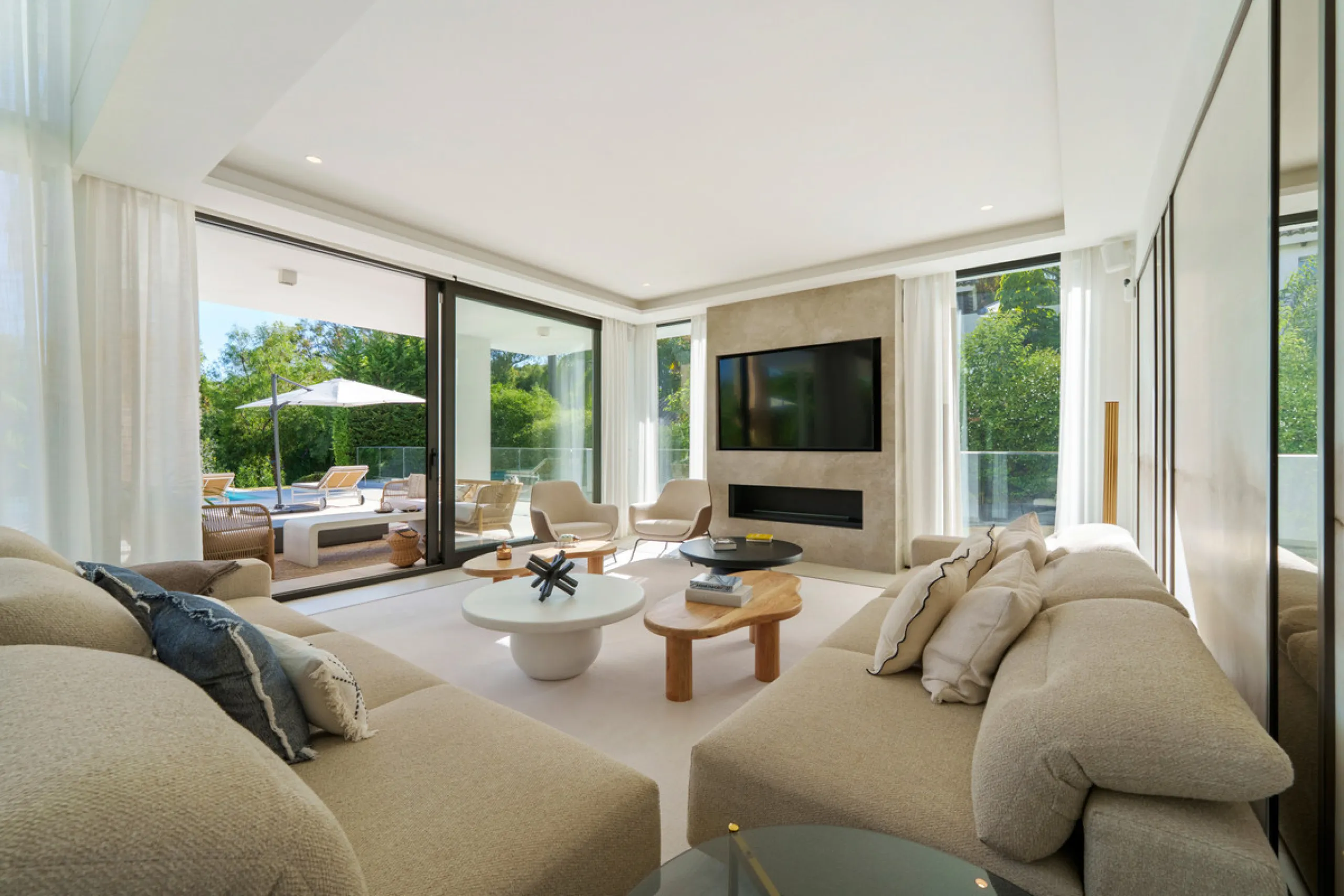 Nestled in the prestigious Altos de Puente Romano on Marbella's Golden Mile, Villa Romano is the epitome of modern Mediterranean luxury. This striking six-bedroom, six-bathroom residence blends sleek contemporary architecture with warm natural tones, crea