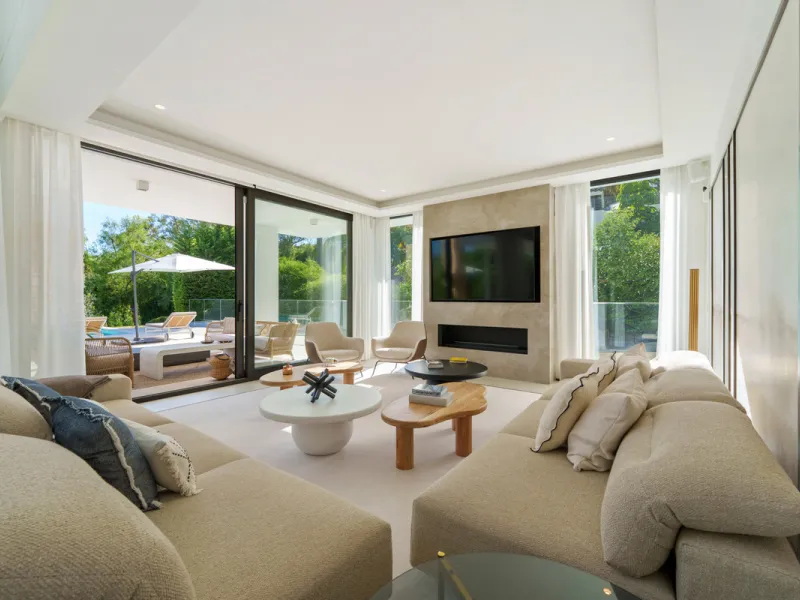 Nestled in the prestigious Altos de Puente Romano on Marbella's Golden Mile, Villa Romano is the epitome of modern Mediterranean luxury. This striking six-bedroom, six-bathroom residence blends sleek contemporary architecture with warm natural tones, crea