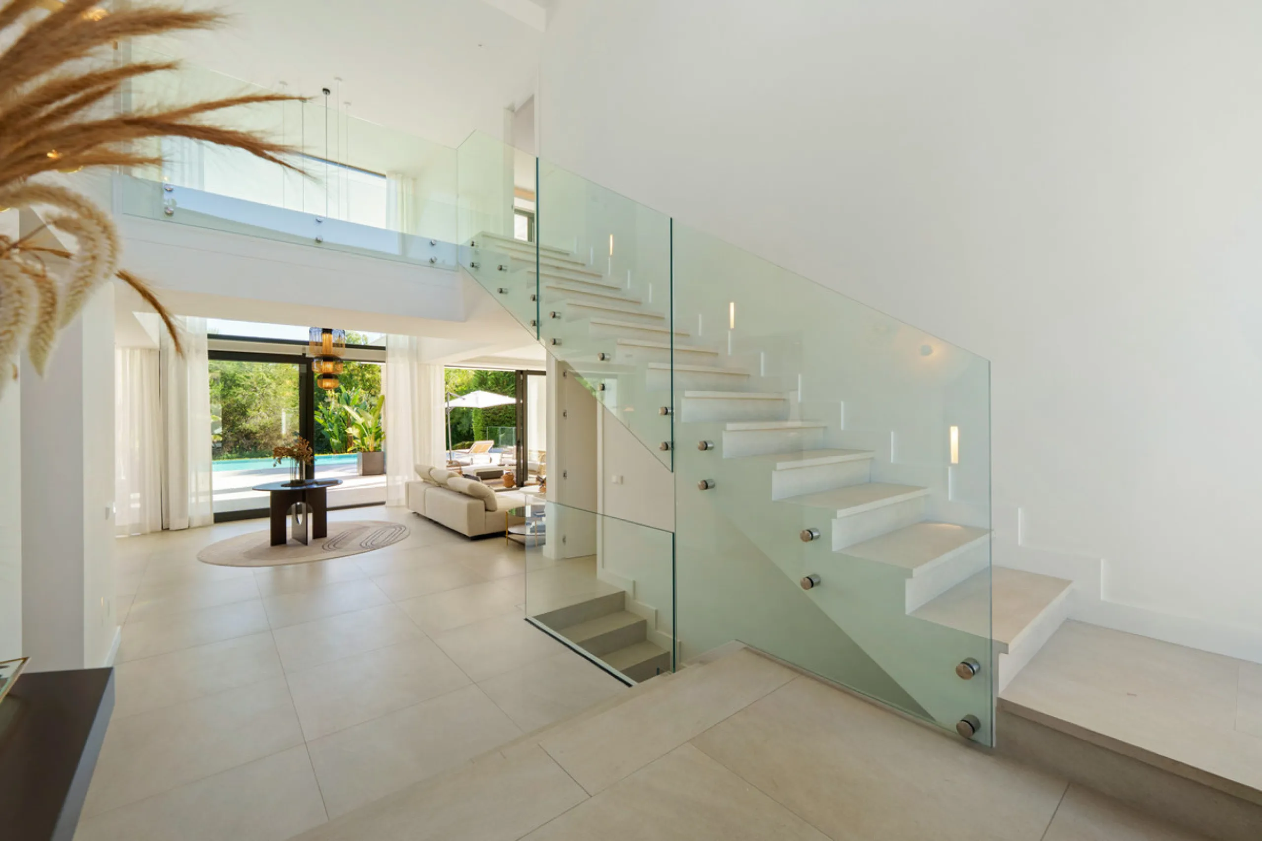 Nestled in the prestigious Altos de Puente Romano on Marbella's Golden Mile, Villa Romano is the epitome of modern Mediterranean luxury. This striking six-bedroom, six-bathroom residence blends sleek contemporary architecture with warm natural tones, crea