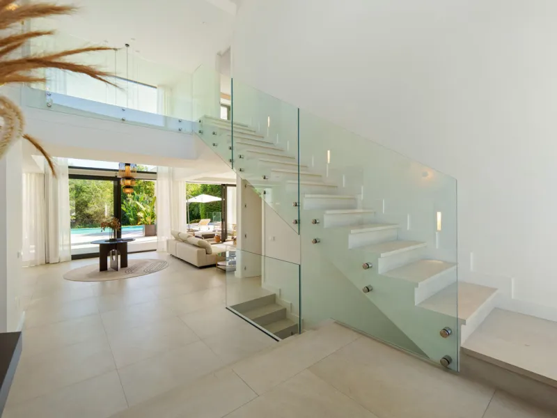 Nestled in the prestigious Altos de Puente Romano on Marbella's Golden Mile, Villa Romano is the epitome of modern Mediterranean luxury. This striking six-bedroom, six-bathroom residence blends sleek contemporary architecture with warm natural tones, crea