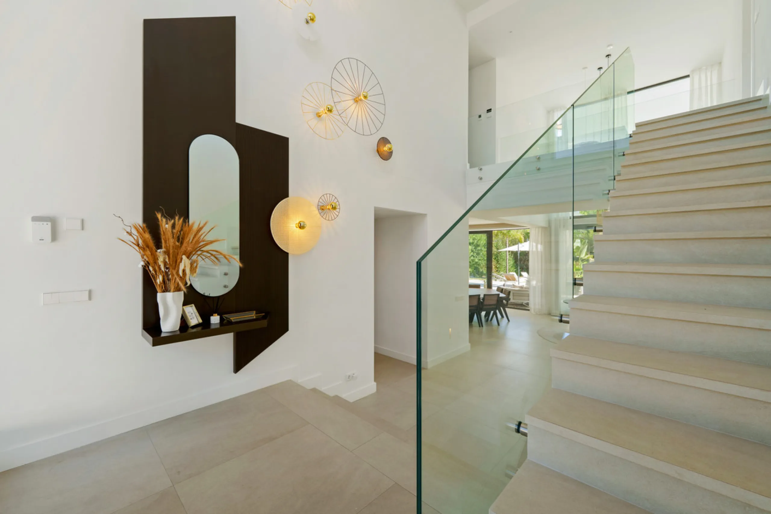 Nestled in the prestigious Altos de Puente Romano on Marbella's Golden Mile, Villa Romano is the epitome of modern Mediterranean luxury. This striking six-bedroom, six-bathroom residence blends sleek contemporary architecture with warm natural tones, crea